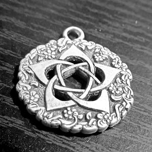 Beautiful, feminine and flowery Pentagram Pendant.  Comes with a cord.